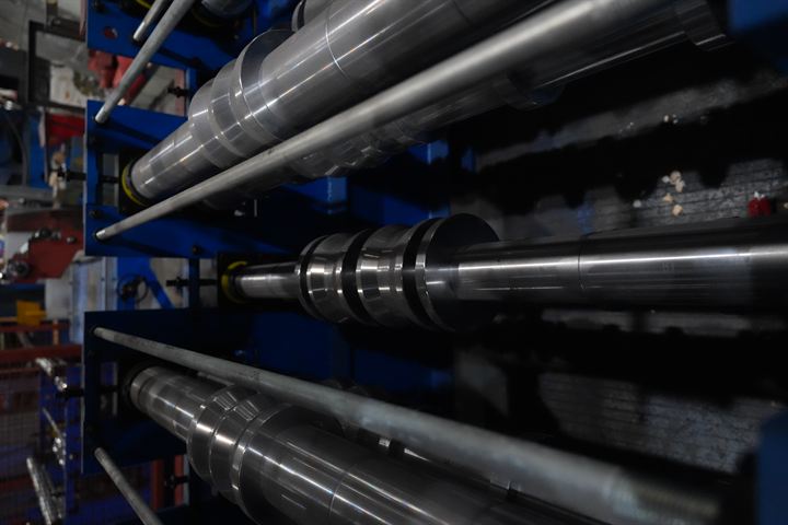 Engineer checking a precision machined roll forming shaft