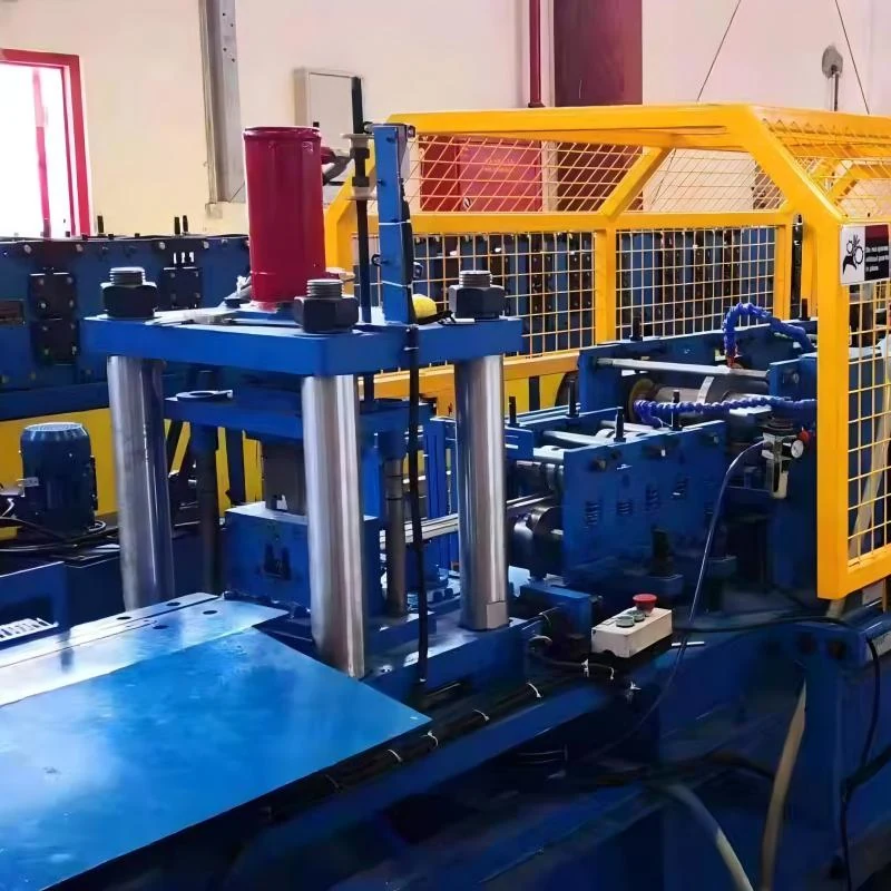 Real workshop photograph of guarded solar mounting profile roll forming equipment