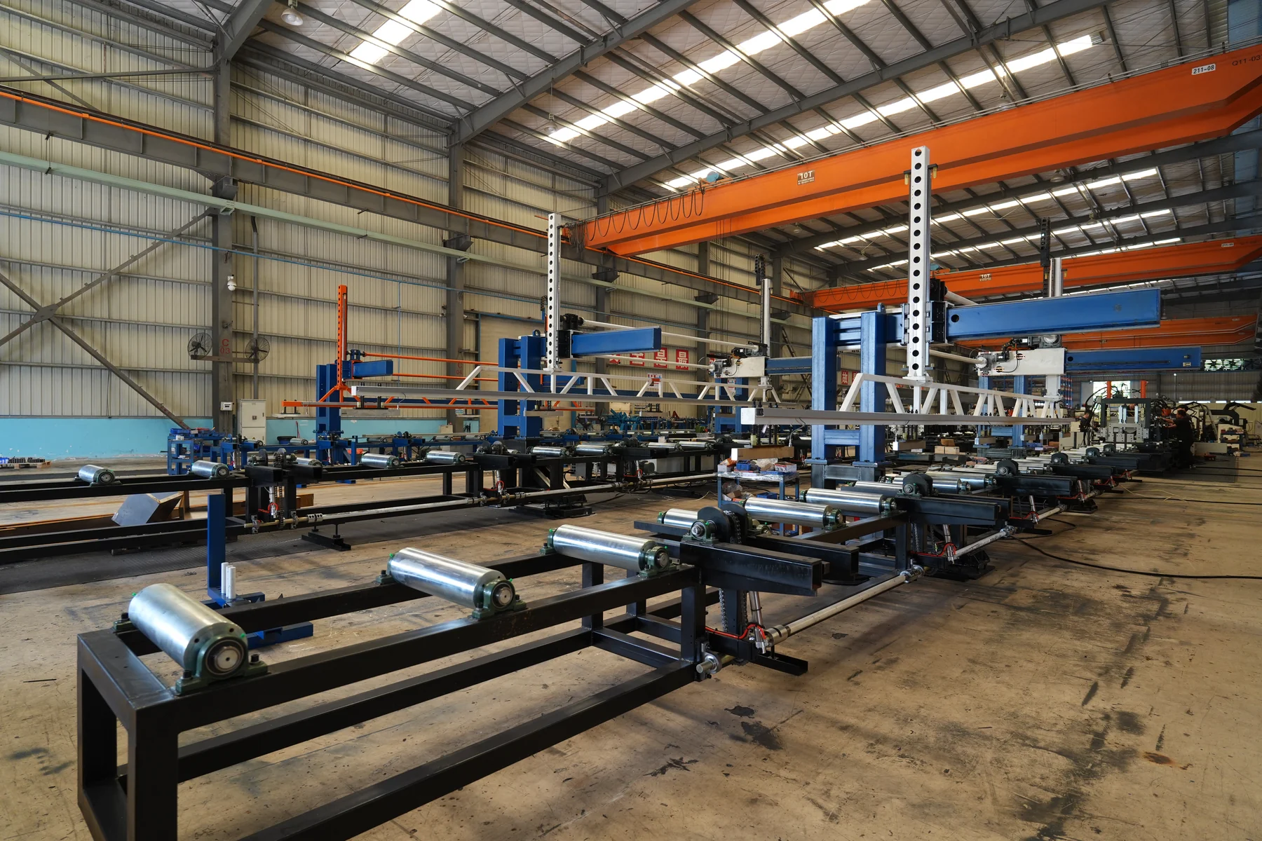 Workshop roller tables and overhead cranes with clear floor space for handling equipment