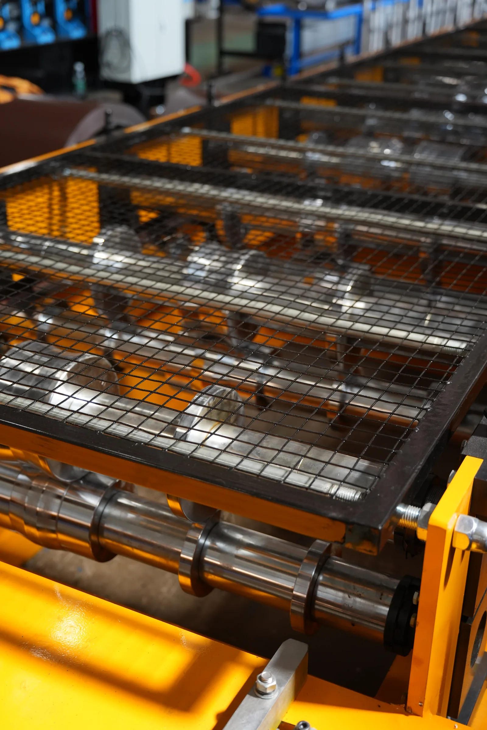 Mesh guard over roll-forming rollers in our Xiamen production base