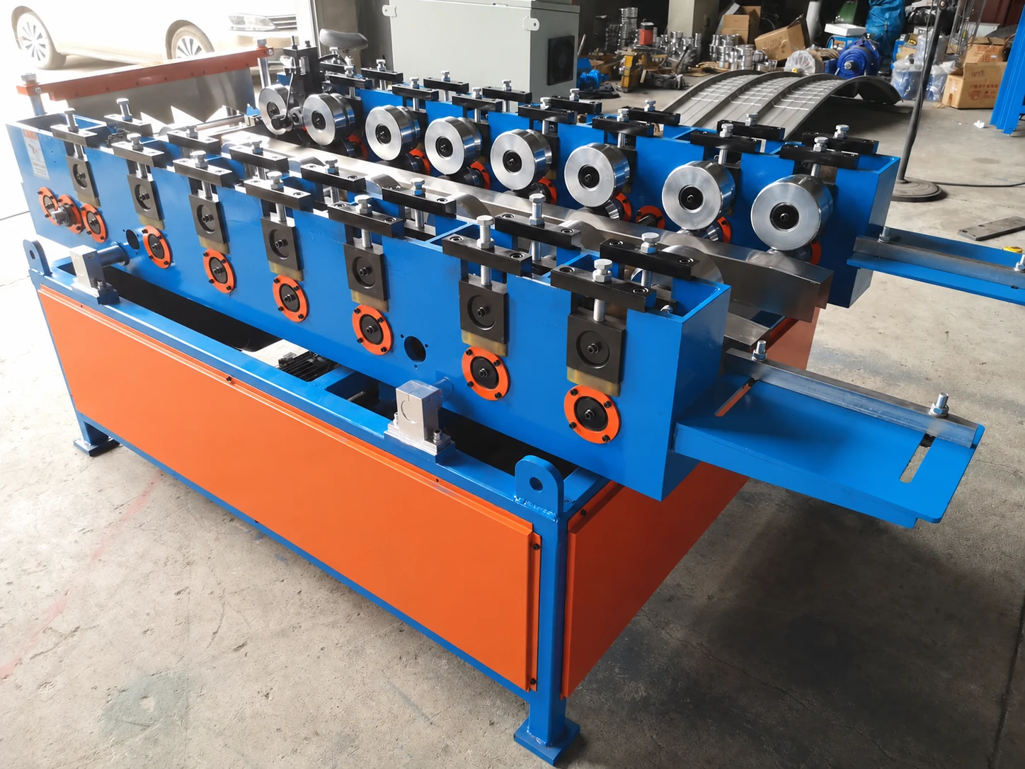 Our Xiamen production base's standing-seam forming rolls in a workshop