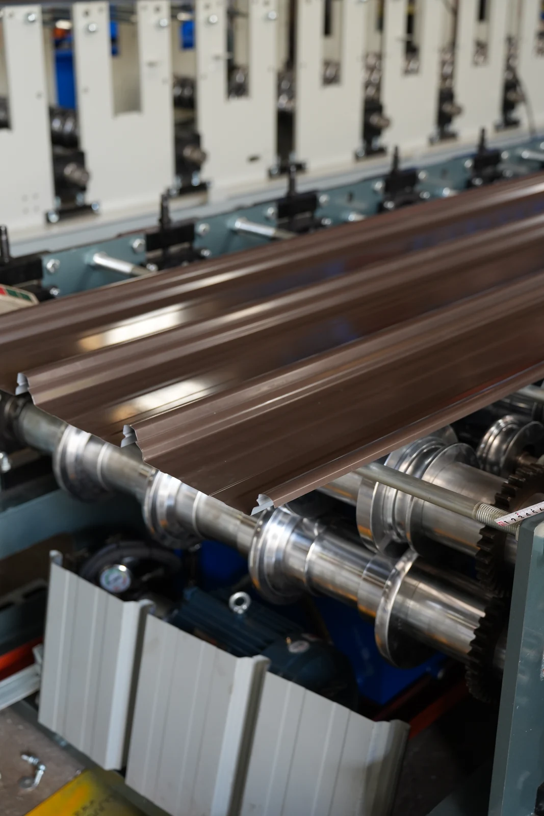 Formed roof profile on roll forming machine rollers in our Xiamen production base