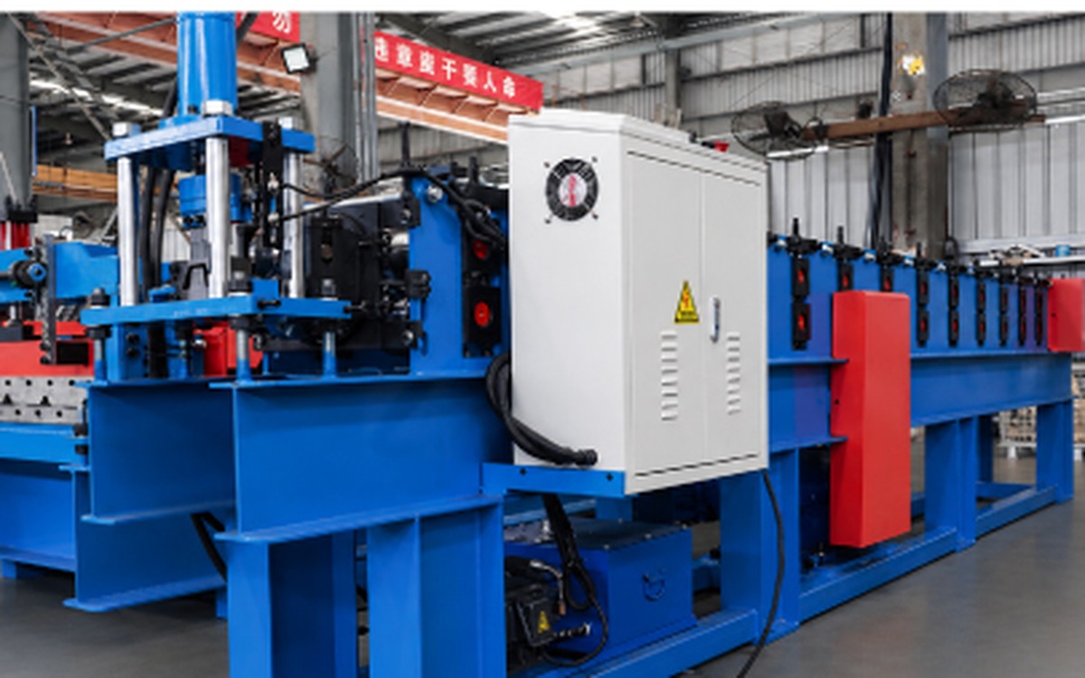 Production-base workshop roll forming equipment; finished ceiling profile is not identifiable in this photograph