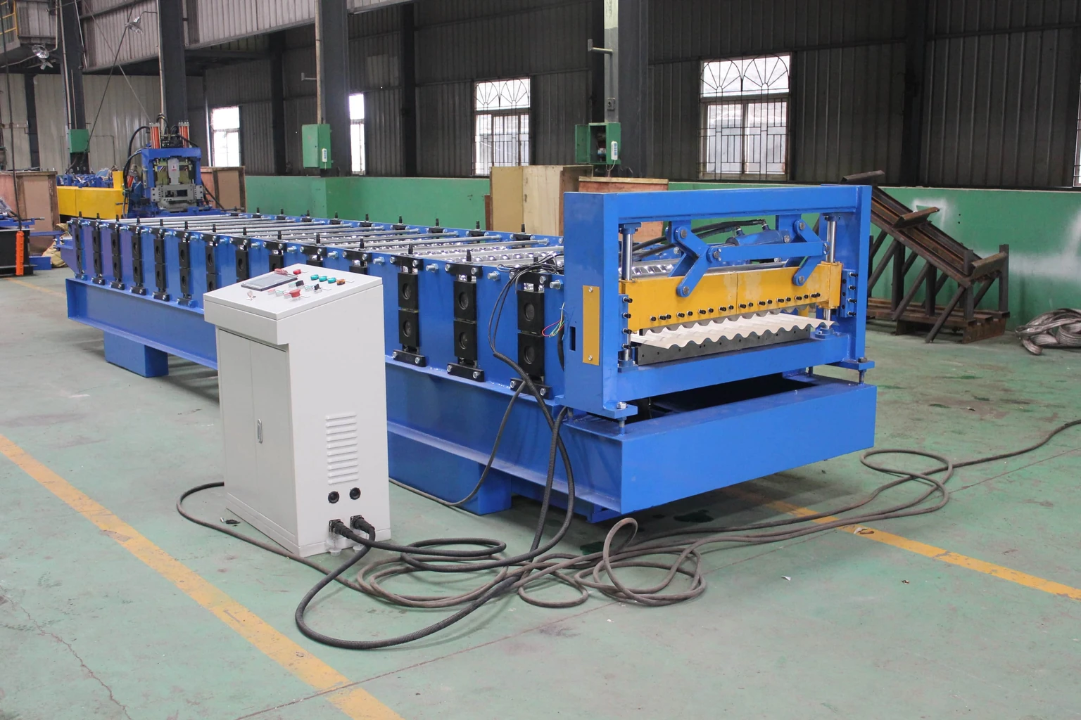 production-base corrugated sheet roll forming line in a workshop; catalogue reference
